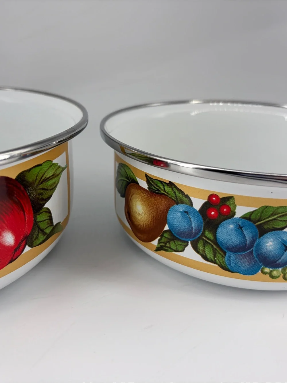 Tabletops Unlimited set of 2 EDEN enamel metal bowls.